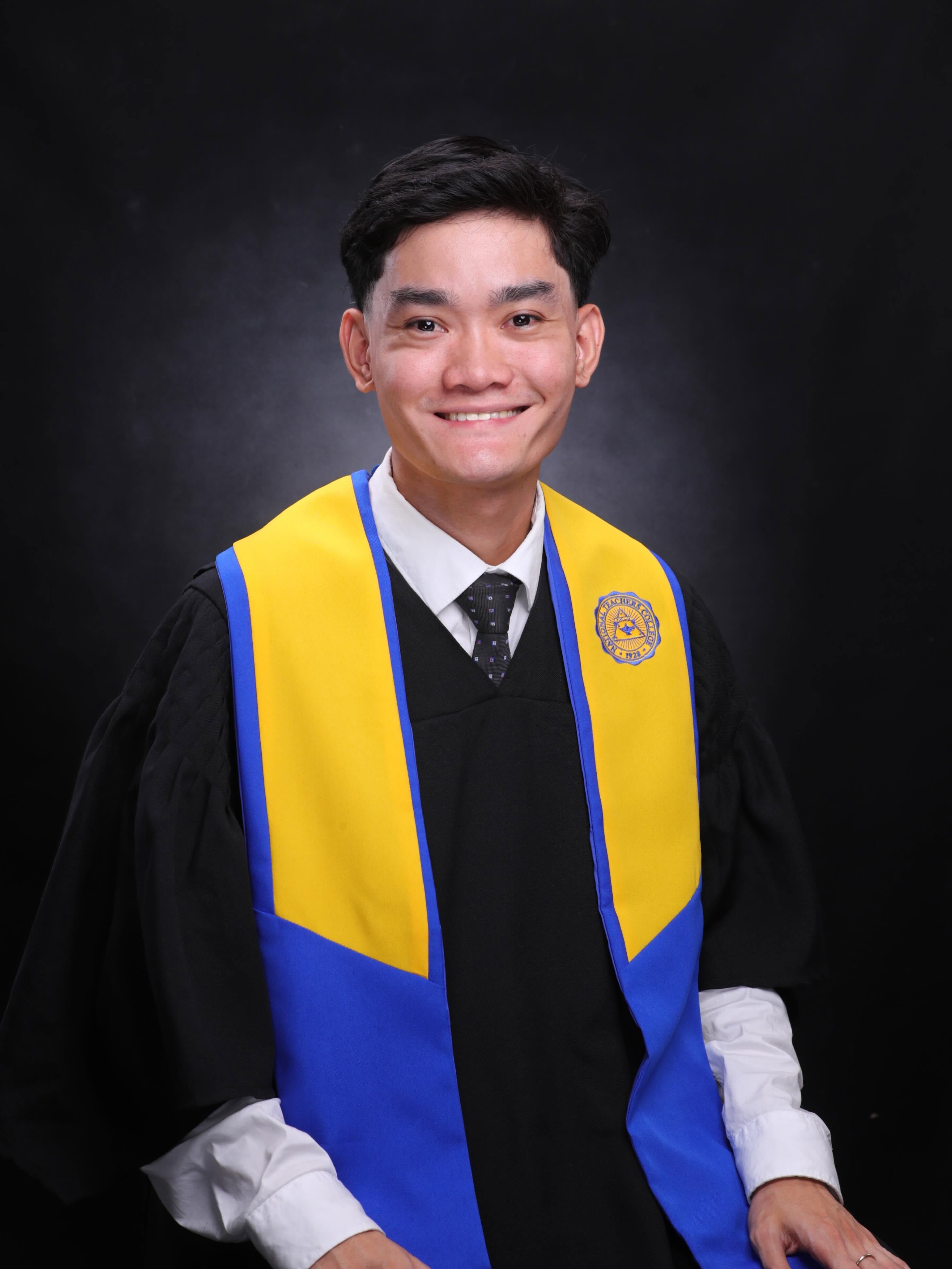 Professional portrait of Gamalliel Tamaca wearing National Teachers College graduation attire